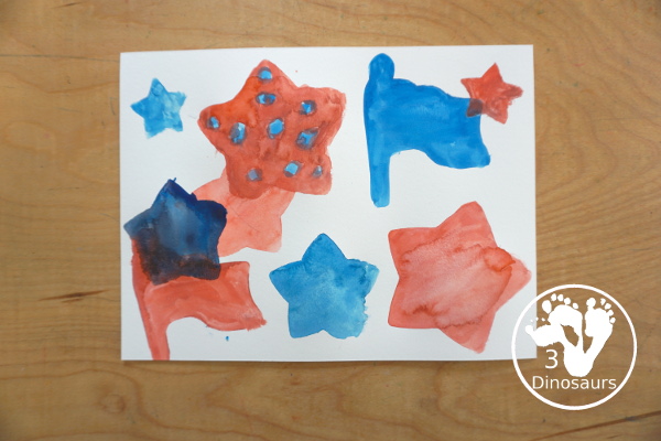 Stars & Flag Watercolor Painting with Cookie Cutters - a simple painting activity that you can do with kids with red and blue colors painting inside stars and flags.- 3Dinosaurs.com