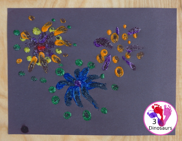 Finger Painting Fireworks with Glitter Paint for kids - easy and fun sensory painting activity that is a great way to make fireworks. - 3Dinosaurs.com