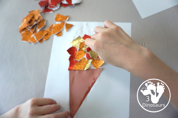 Glitter Olympic Torch Craft with Torn Paper Art - is an easy to make torn paper craft for the Olympics that kids can make - 3Dinosaurs.com