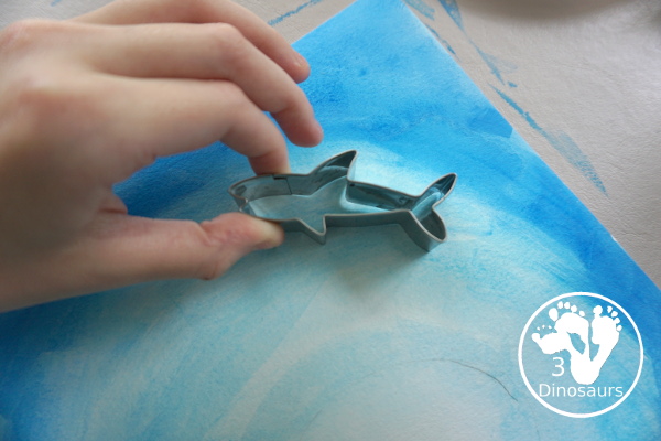 Shark Cookie Cutter Painting with Q-tip & Watercolors - a fun painting activity that kids of different ages can do. It is a fun way to work on colors and fine motor painting with q-tips and watercolors - 3Dinosaurs.com