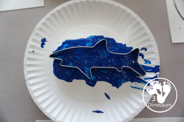 Shark Cookie Cutter Painting - a great painting activity for kids of all ages and works great with tot and preschool age kids for a shark paint activity - 3Dinosaurs.com