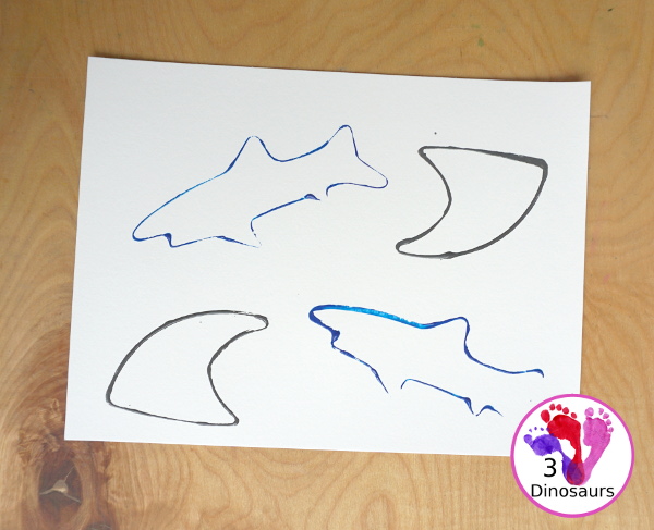 Shark Cookie Cutter Painting - a great painting activity for kids of all ages and works great with tot and preschool age kids for a shark paint activity - 3Dinosaurs.com