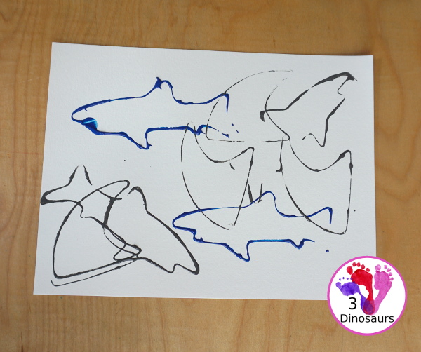 Shark Cookie Cutter Painting - a great painting activity for kids of all ages and works great with tot and preschool age kids for a shark paint activity - 3Dinosaurs.com