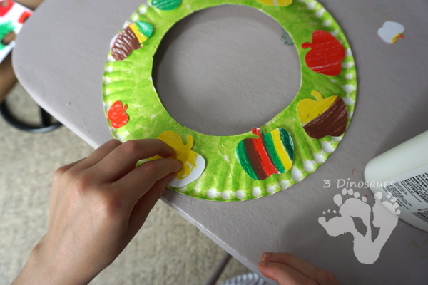 Fun Apple Themed Wreath: with oil pastels and apple punches - easy to do wreath that is great for fall  - 3Dinosaurs.com