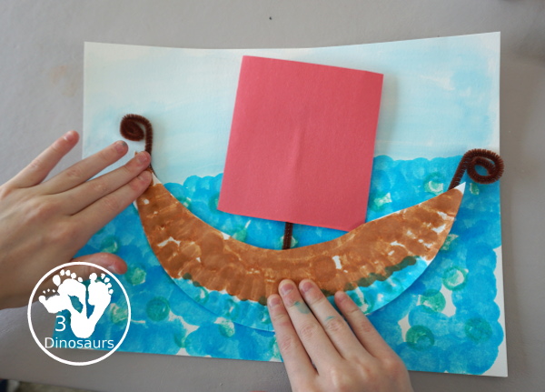 Easy to Make Viking Ship with Viking Ships at Sunrise - with a paper plate, dot markers, and watercolors to make this fun craft of a Viking Ship for the Magic Tree House Book- 3Dinosaurs.com