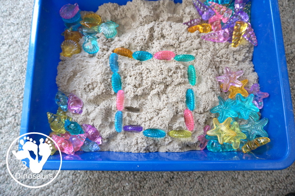 Beach Kinetic Sand & Shell Sensory Bin - for an easy to set up sensory play that kids can do any time of the year and work great for a beach theme day - 3Dinosaurs.com