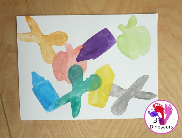 School Cookie Cutter Watercolor Painting - a super easy back to school watercolor painting with cookie cutters with school themes of pencils, scissors, crayons and apples - 3Dinosaurs.com