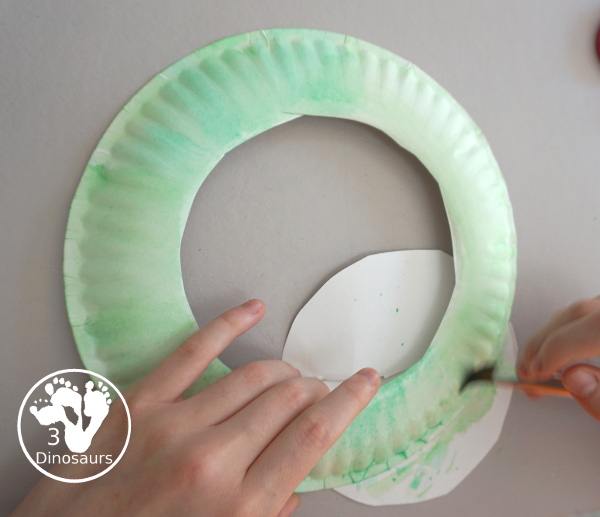 Apple Tree Wreath Craft for kids with paper plate, watercolor and apple punches to use to make this fun wreath for fall with a fun apple theme - 3Dinosaurs.com