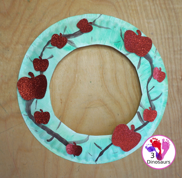 Apple Tree Wreath Craft for kids with paper plate, watercolor and apple punches to use to make this fun wreath for fall with a fun apple theme - 3Dinosaurs.com