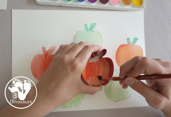 Apple Cookie Cutter Painting - An easy watercolor apple painting activity for various ages can do. With a cookie cutter for the template for the apple - 3Dinosaurs.com