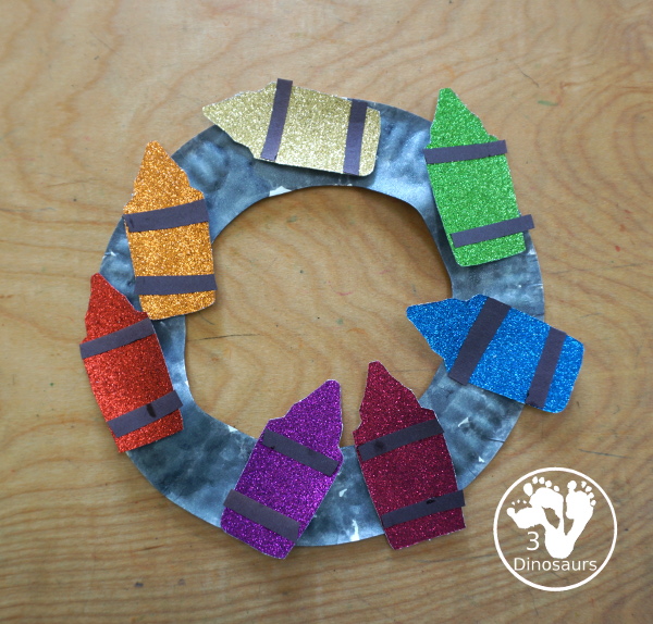 Glitter Crayon Wreath Craft For Kids - a great color or back to school glitter crayons wreath you can make with kids. - 3Dinosaurs.com