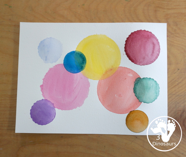 Circle Watercolor Painting with Cookie Cutters - a is great shape painting you can do with kids. You can use different sizes of cookie cutters for it and paint inside the cookie cutter to get the shape. - 3Dinosaurs.com